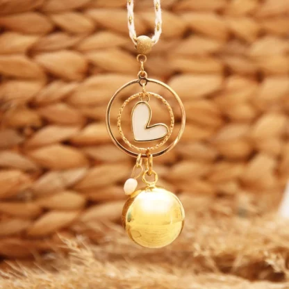 bola grigri coeur pour future maman
